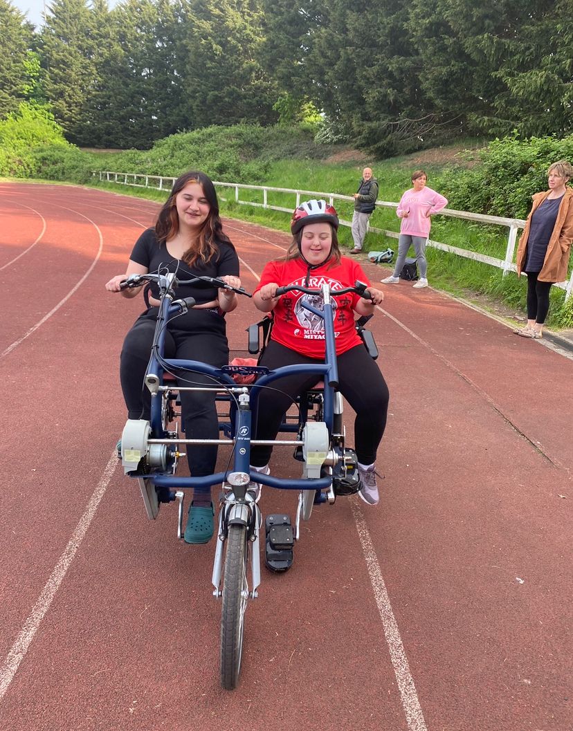 SENSations member riding a bike